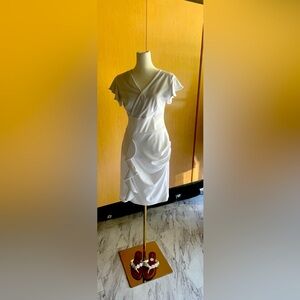 NWOT White dress size small zip up back flowing fit & beautiful neckline.